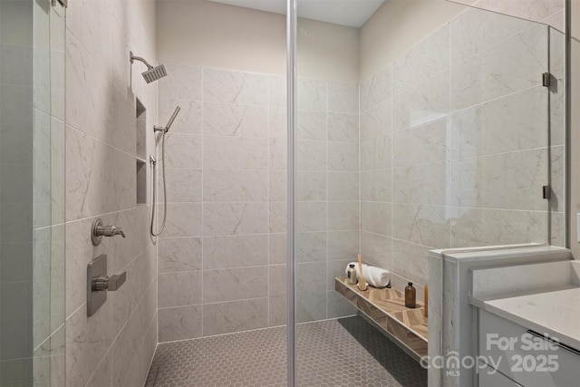 bathroom with tiled shower