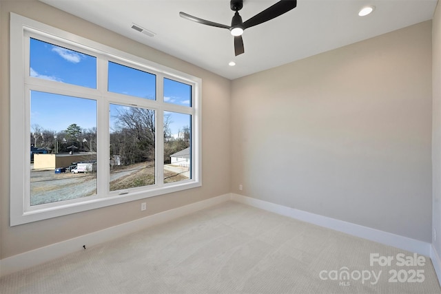 carpeted empty room with ceiling fan