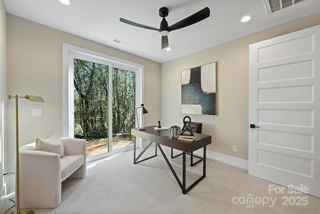 office with ceiling fan and light carpet