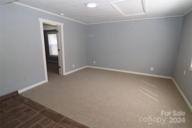 410 Clinton Dr, Kings Mountain, NC 28086 - spare room with attic access, dark colored carpet, ornamental molding, and baseboards