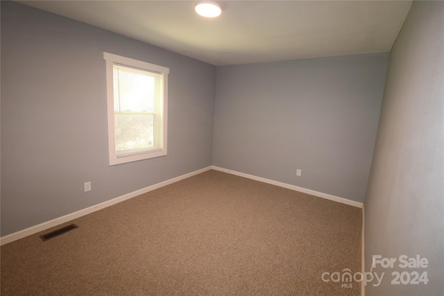 410 Clinton Dr, Kings Mountain, NC 28086 - carpeted empty room with visible vents and baseboards