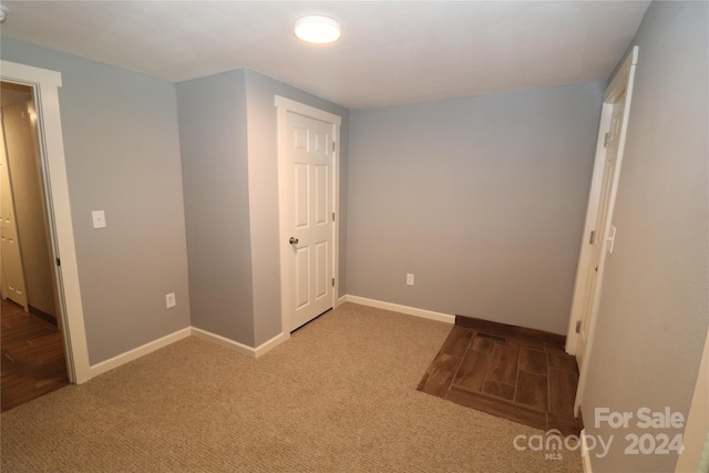 unfurnished bedroom featuring carpet