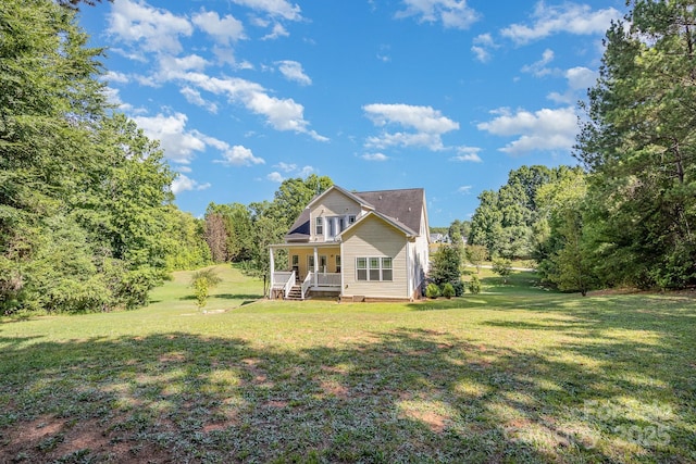 view of front of home with a porch and a front lawn