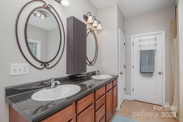 bathroom with tile patterned flooring and vanity