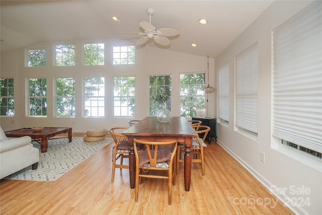 dining area with ceiling fan, lofted ceiling, and light hardwood / wood-style floors