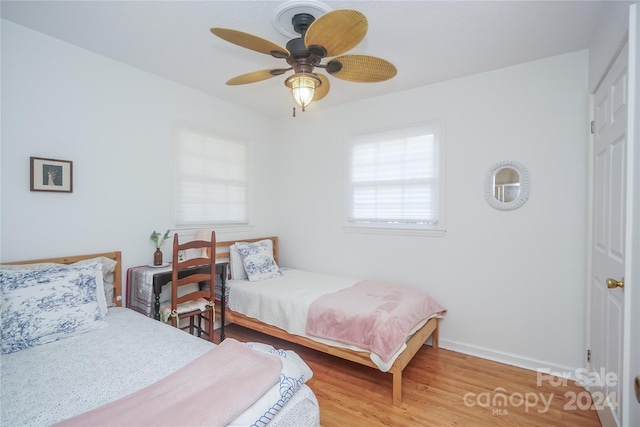 bedroom featuring ceiling fan and hardwood / wood-style floors