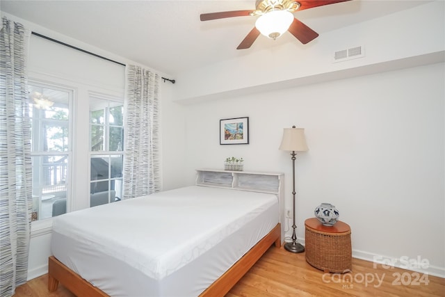 bedroom featuring ceiling fan and hardwood / wood-style floors