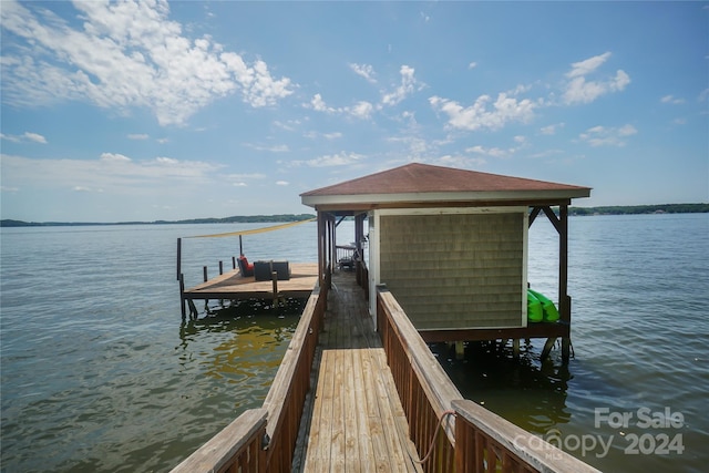 view of dock with a water view