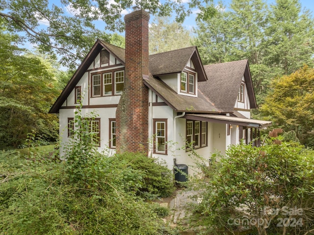 rear view of house with central AC