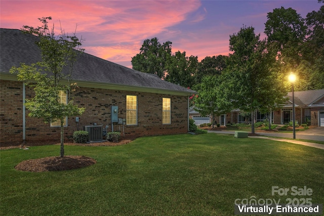 exterior space with a lawn and cooling unit