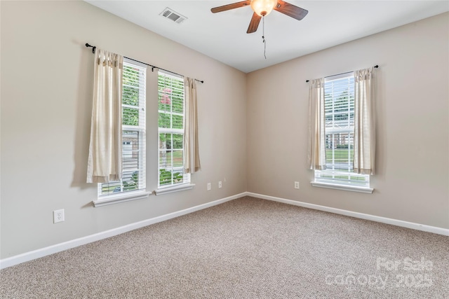 empty room with carpet floors and ceiling fan