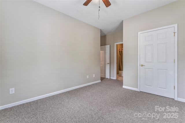 unfurnished bedroom with ceiling fan and carpet