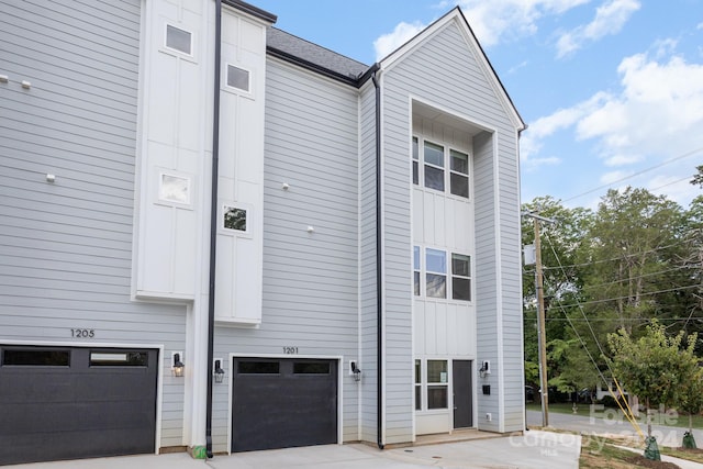 view of property exterior featuring a garage