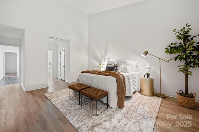 bedroom with hardwood / wood-style floors