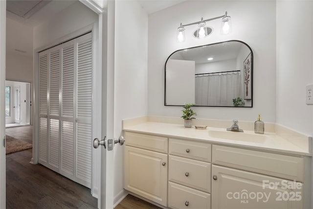 bathroom featuring vanity and wood-type flooring