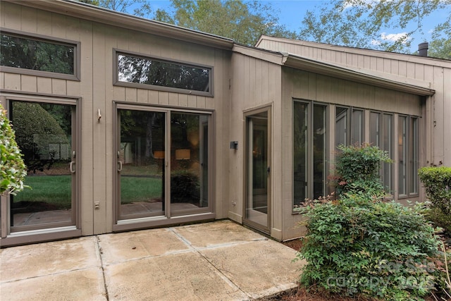 entrance to property featuring a patio