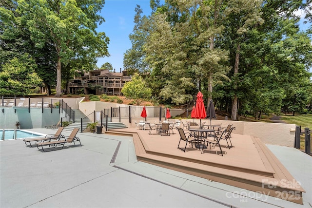 view of patio featuring a community pool