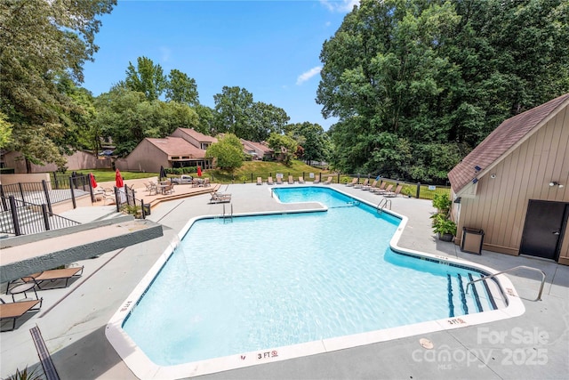 view of swimming pool featuring a patio area