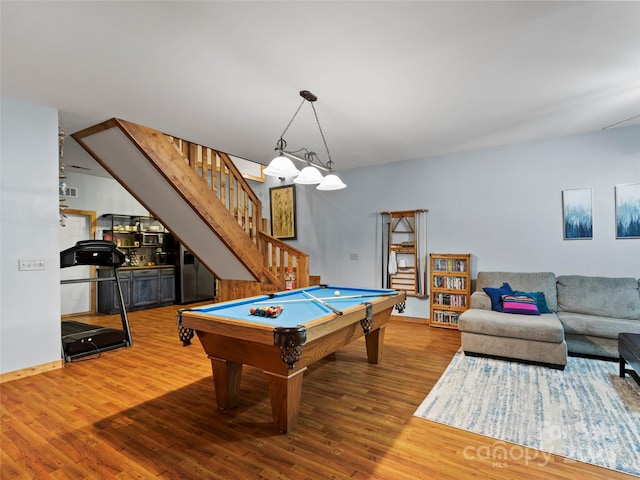 rec room with hardwood / wood-style flooring and pool table