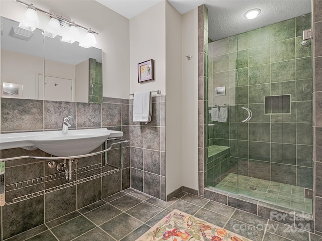 bathroom featuring tile walls, independent shower and bath, decorative backsplash, a textured ceiling, and tile patterned flooring