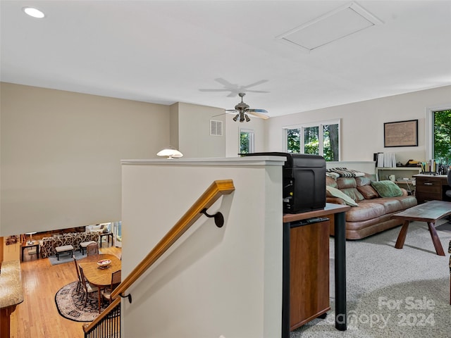 interior space featuring ceiling fan