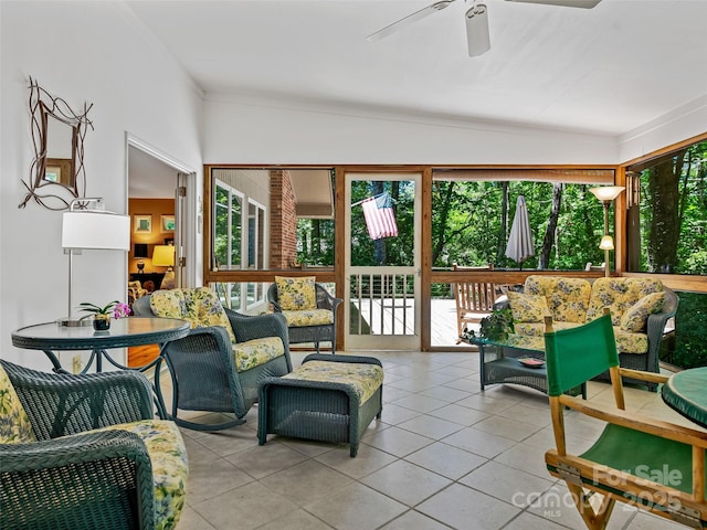 sunroom / solarium featuring ceiling fan