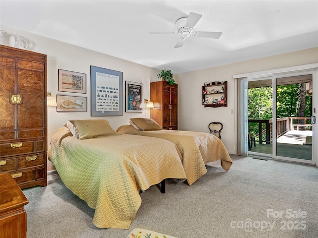 carpeted bedroom with access to exterior and ceiling fan