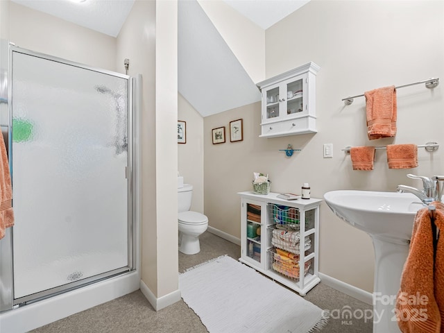 bathroom with walk in shower, toilet, and sink