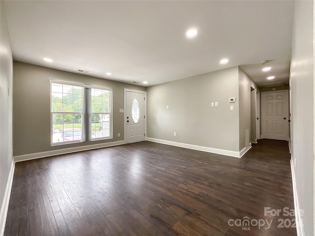 unfurnished room featuring dark hardwood / wood-style floors