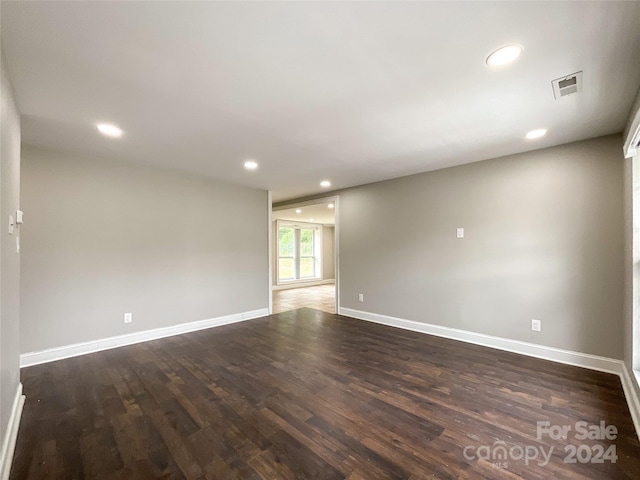 unfurnished room featuring dark hardwood / wood-style floors