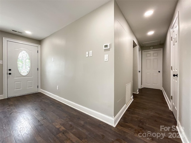 entrance foyer with dark hardwood / wood-style floors