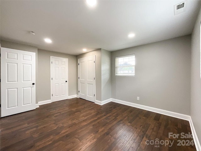 interior space with dark hardwood / wood-style flooring