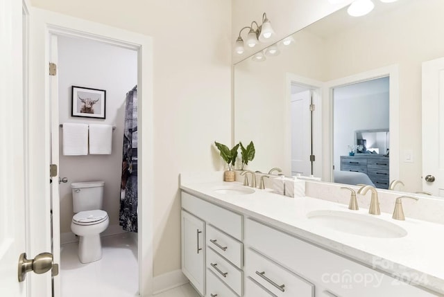 bathroom with toilet and vanity