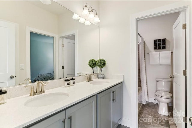 bathroom with toilet and vanity