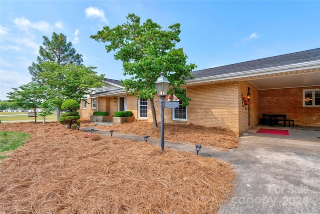 view of front of home featuring a carport