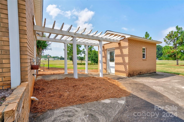 exterior space with a patio area and a pergola