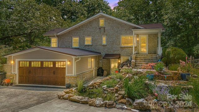 view of front of property with a garage