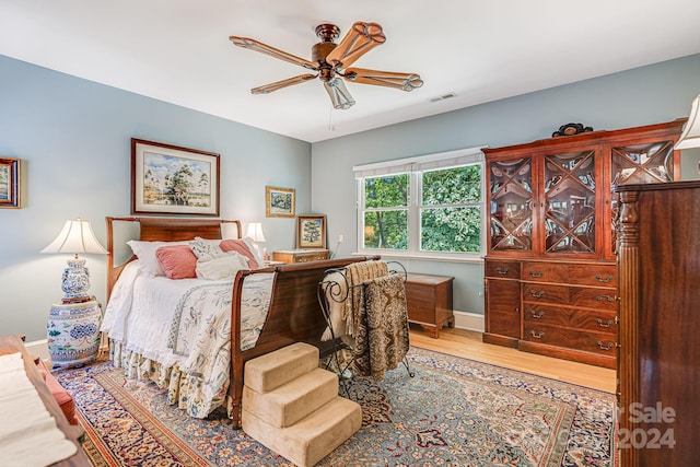 bedroom featuring wood-type flooring and ceiling fan