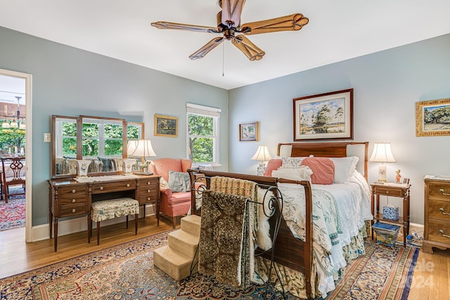 bedroom featuring ceiling fan and wood-type flooring