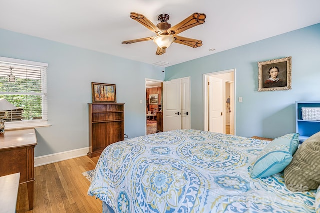 bedroom with light wood-type flooring and ceiling fan