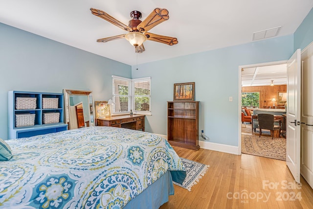 bedroom featuring light hardwood / wood-style flooring and ceiling fan