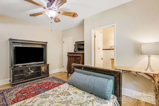 living room with light wood-type flooring and ceiling fan