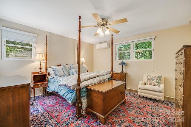 bedroom with a wall mounted AC, multiple windows, and ceiling fan