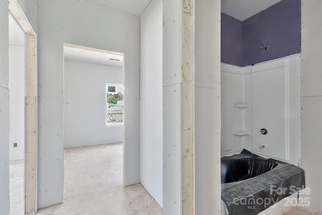 bathroom featuring concrete flooring