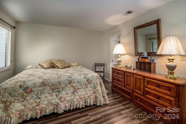 bedroom featuring dark wood-type flooring