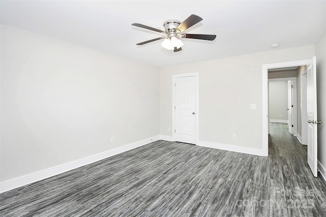 unfurnished bedroom with a ceiling fan, baseboards, and dark wood finished floors