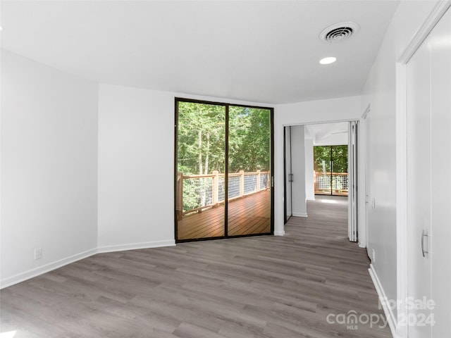 empty room featuring hardwood / wood-style flooring