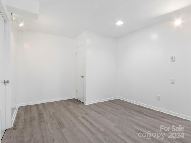 unfurnished room featuring light hardwood / wood-style floors