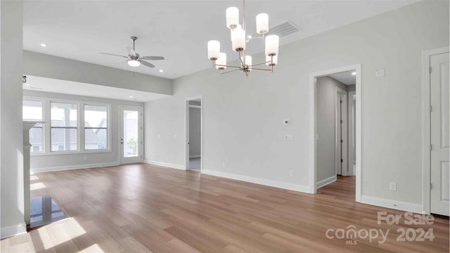 unfurnished living room with light hardwood / wood-style floors and ceiling fan with notable chandelier