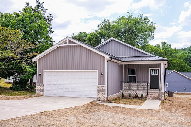 craftsman house with a garage and covered porch